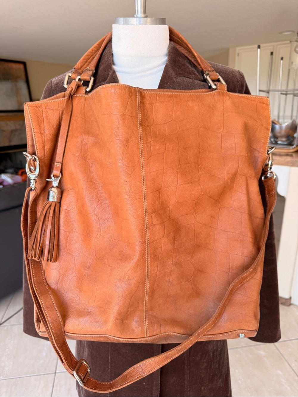 ARCADIA Caramel Leather Tote Bag with Tassel has crossbody strap